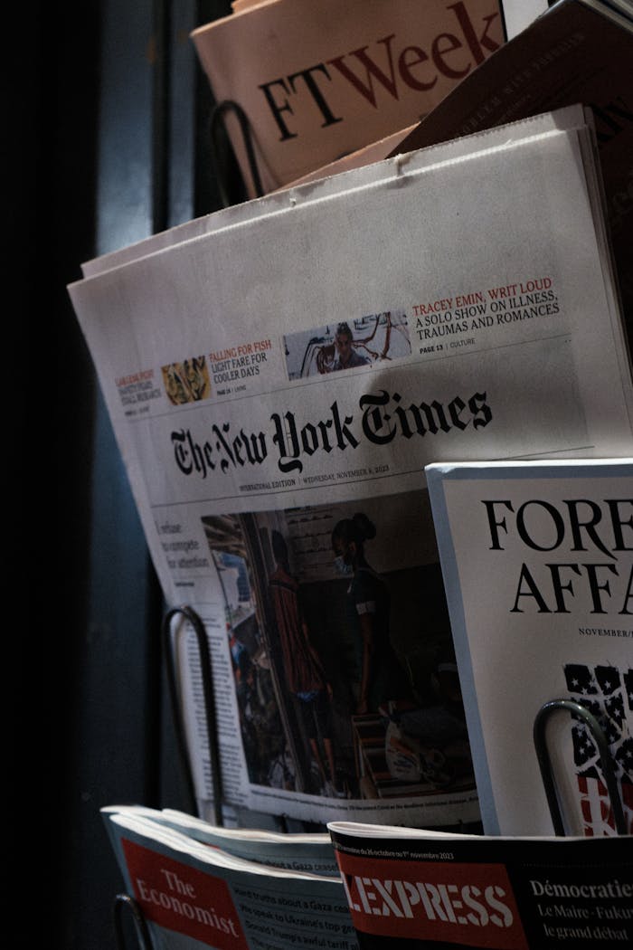 why-choose-me A detailed look at a newspaper stand showcasing The New York Times and other publications.